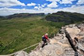 Travel photography:Climber arriving on top of the Morro do Pai Inácio, Brazil