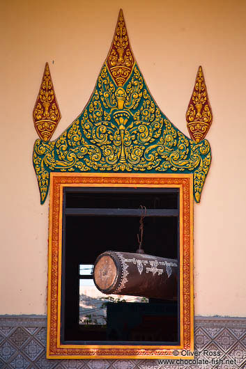 Temple window with large drumm near Odonk (Udong) 