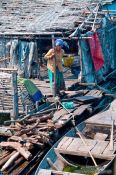 Travel photography:Woman on her floating house near Tonle Sap lake, Cambodia