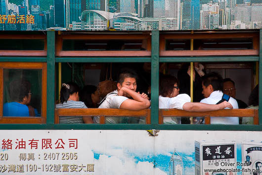 Passengers in a tram in downtown Hong Kong