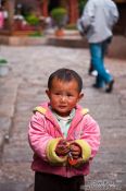 Travel photography:Small child in Lijiang street, China