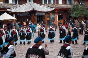 Travel photography:Group of Naxi women performing a traditional dance in Lijiang, China