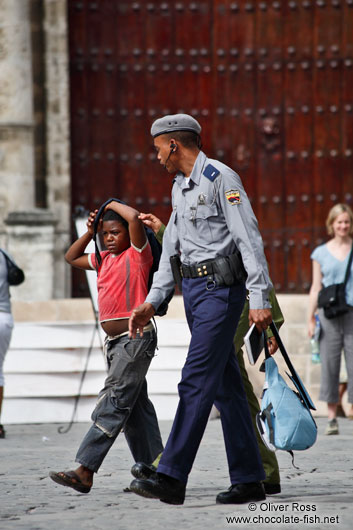 Boy with policeman in Old Havana