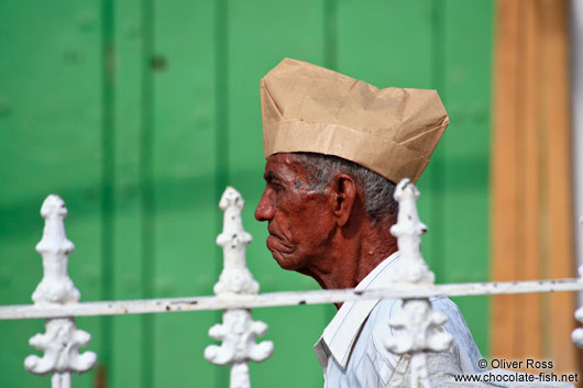 Man with paper hat in Trinidad