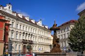 Travel photography:Houses and fountain in Prague`s Old Town, Czech Republic