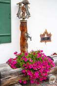 Travel photography:Water fountain with flowers in Garmisch-Partenkirchen, Germany