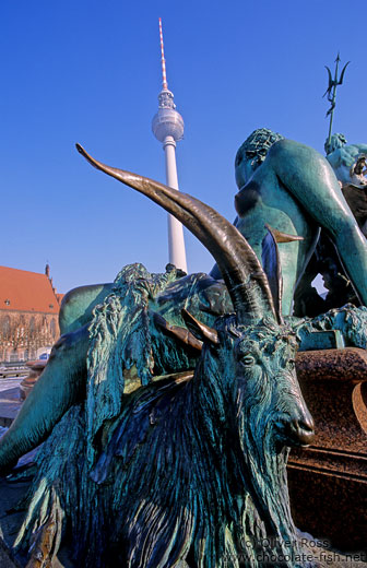Neptunbrunnen (Neptune`s fountain) on Berlin`s Alexanderplatz with St.-Marien Kirche and Fernsehturm in the background