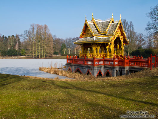 Frozen lake with Thai pavilion at the Tierpark Hagenbeck zoo in Hamburg