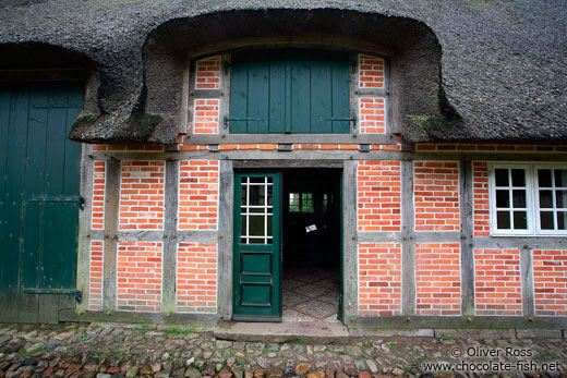 18th century Frisian house with typical roof and half-timbered brick facade 