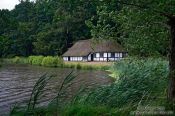 Travel photography:18th century half-timbered house and lake, Germany