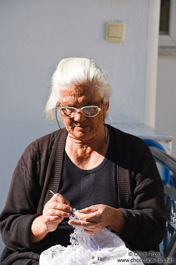 Woman knitting in a village near Garazo