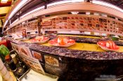 Travel photography:Fresh sushi arrive on a conveyor belt in a Tokyo restaurant, Japan