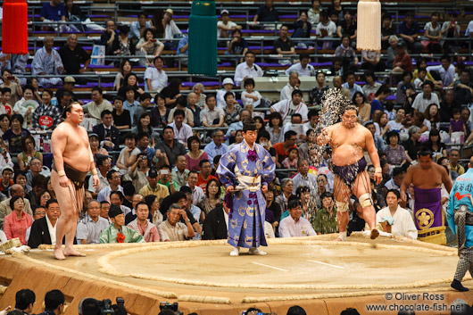 Cleansing the ring by throwing salt in preparation for a bout at the Nagoya Sumo Tournament