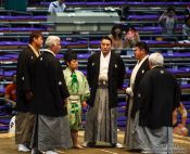 Travel photography:The five shimpan (judges) usually seated around the ring meet in the center to hold a mono-ii at the Nagoya Sumo Tournament, Japan