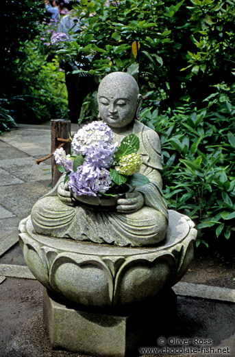 Buddha with flower offerings in Kamakura