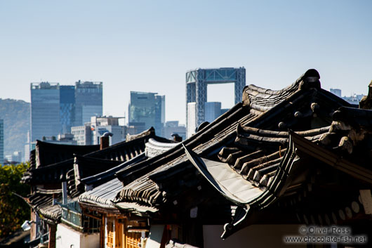 View of the modern high rises from Seoul`s Bukchon Hanok village