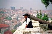 Travel photography:Man in traditional dress in Lisbon`s São Jorge Castle, Portugal