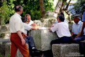 Travel photography:Men Playing Cards in Lisbon`s São Jorge Castle, Portugal