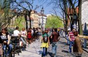 Travel photography:Street cafes with people along the river in Ljubljana, Slovenia