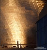 Travel photography:Evening light hits the facade of the Bilbao Guggenheim Museum, Spain