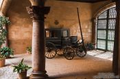 Travel photography:Old horse cart inside a classical baroque patio in a Palma house, Spain