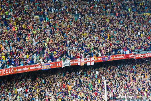 Spectators celebrate the victory of the Supercup 2011 by the FC Barcleona in their home stadium in Camp Nou