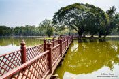 Travel photography:Lake with bridge and island at the Sukhothai temple complex, Thailand