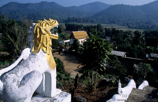 Guardian overlooking a valley near Chiang Rai