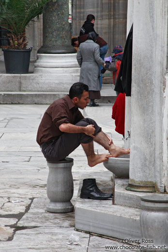 Ritual cleansing before the Friday prayer outside Yeni Mosque in Istanbul