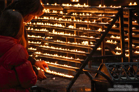Lighting candles inside Stephansdom cathedral
