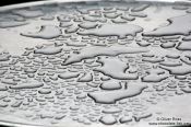 Travel photography:Water left on a street cafe table after a rain shower, Austria
