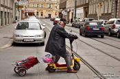 Travel photography:Man on a small scooter in Vienna , Austria