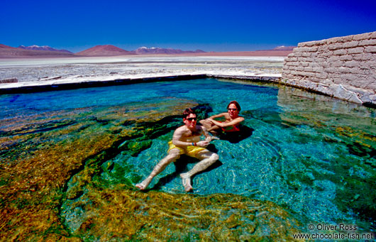 Tourists in a volcanic pool
