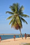 Travel photography:People on Boipeba Island beach, Brazil