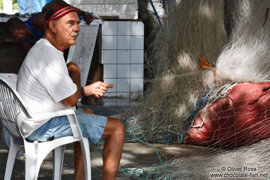 Copacabana fisherman mending his net