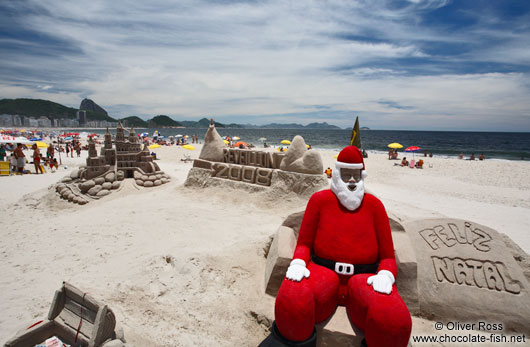 Santa Claus on a sand castle at Copacabana beach in Rio
