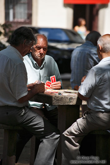 Men playing cards in a Rio park