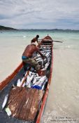 Travel photography:Fisherman landing their catch of bonito fish at Arraial-do-Cabo beach, Brazil