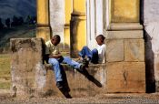 Travel photography:Two boys playing with their mobile phones, Ouro Preto, Brazil