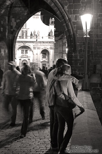 Couple on Charles bridge by night