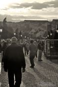 Travel photography:People on Charles Bridge (with a dark yellow tint), Czech Republic