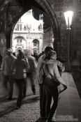 Travel photography:Couple on Charles bridge by night, Czech Republic