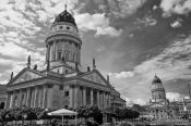 Travel photography:The German (foreground) and French Dome on the Gendarmenmarkt in Berlin, Germany