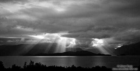 Rays of light break through the clouds in Fiordland National Park