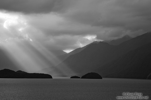 Rays of light break through the clouds in Fiordland National Park