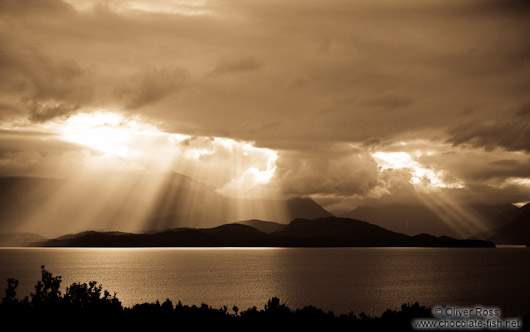 Rays of light break through the clouds in Fiordland National Park