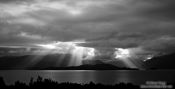 Travel photography:Rays of light break through the clouds in Fiordland National Park, New Zealand