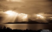 Travel photography:Rays of light break through the clouds in Fiordland National Park, New Zealand