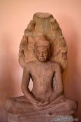 Travel photography:Sitting buddha sculpture at the Phnom Penh National Museum , Cambodia