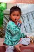 Travel photography:Small girl at Wat Phnom in Phnom Penh, Cambodia